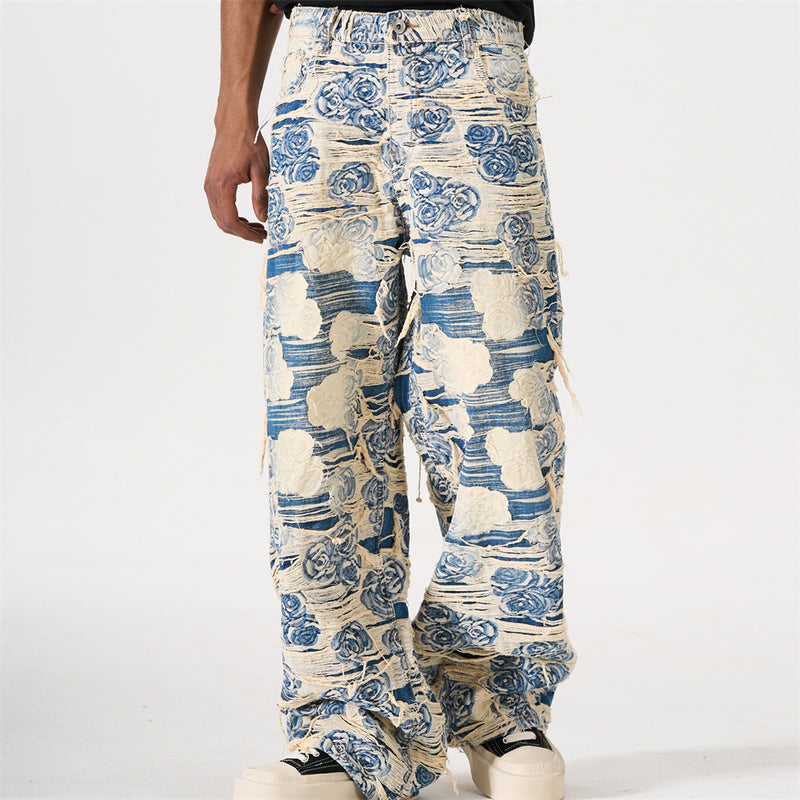 Men's wide-leg blue rose jacquard distressed jeans with fringe detailing, front and back view