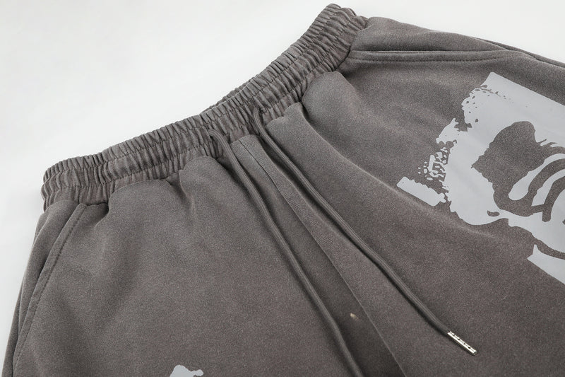 Pantalones de chándal de pierna ancha con cruz estampada y acabado lavado ácido