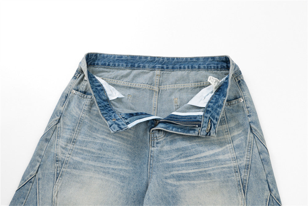 Close-up of open waistband and zipper fly on light blue denim shorts