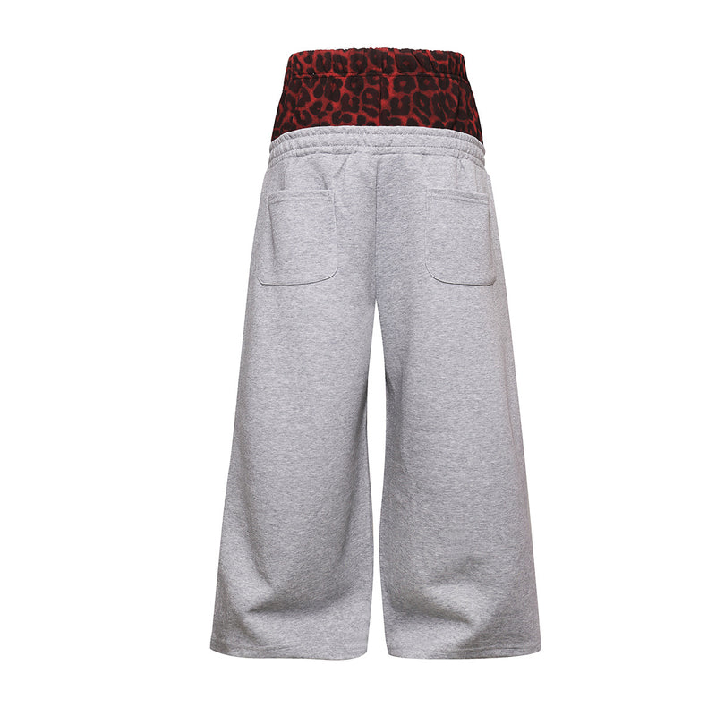 Wide-Leg-Jogginghose mit Leo-Print-Bund & seitlichen Nieten