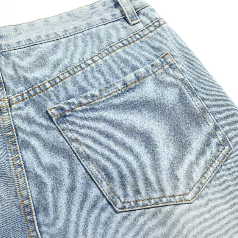 Close-up of back patch pocket on light wash denim