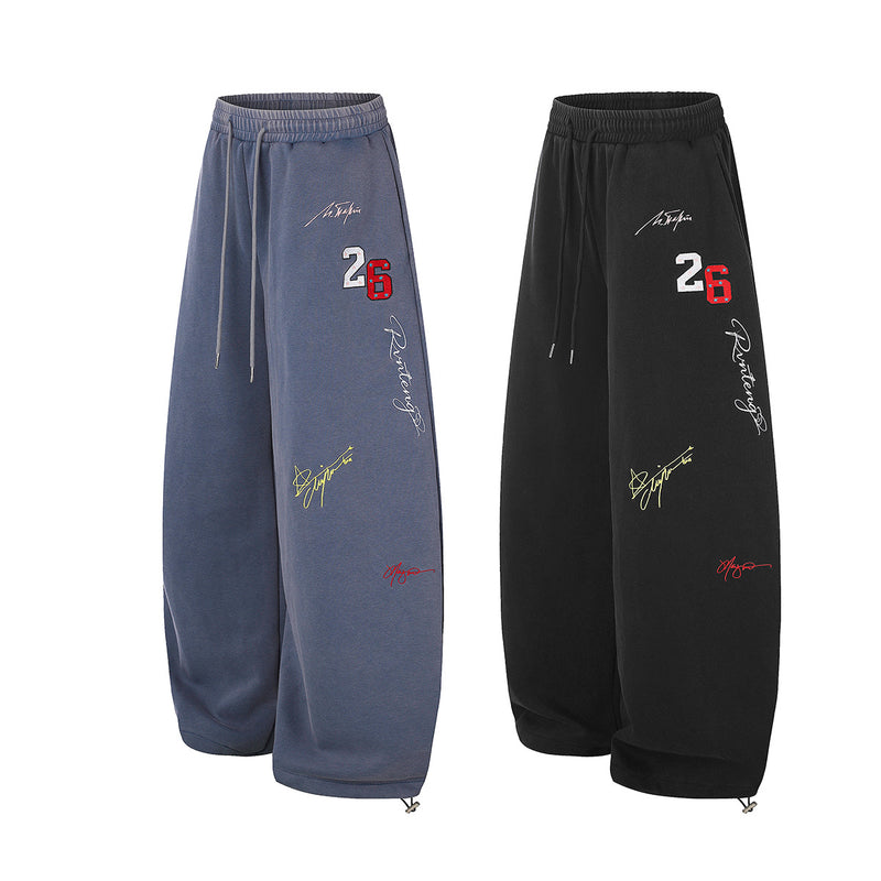 Pantalon de survêtement à jambes larges avec broderies graffiti signature et numéro 26