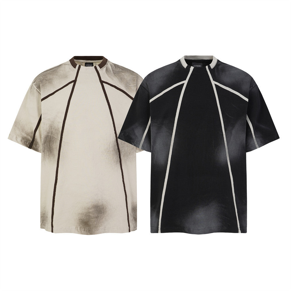 Post-apocalyptic dirty wash oversized punk t-shirt with contrast geometric seam lines in off-white and black colorways