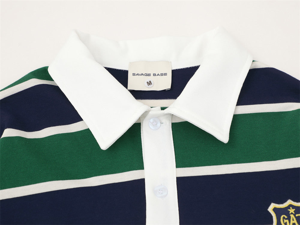 Close-up of white collar and button placket on striped rugby polo shirt