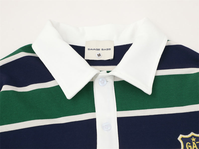 Close-up of white collar and button placket on striped rugby polo shirt