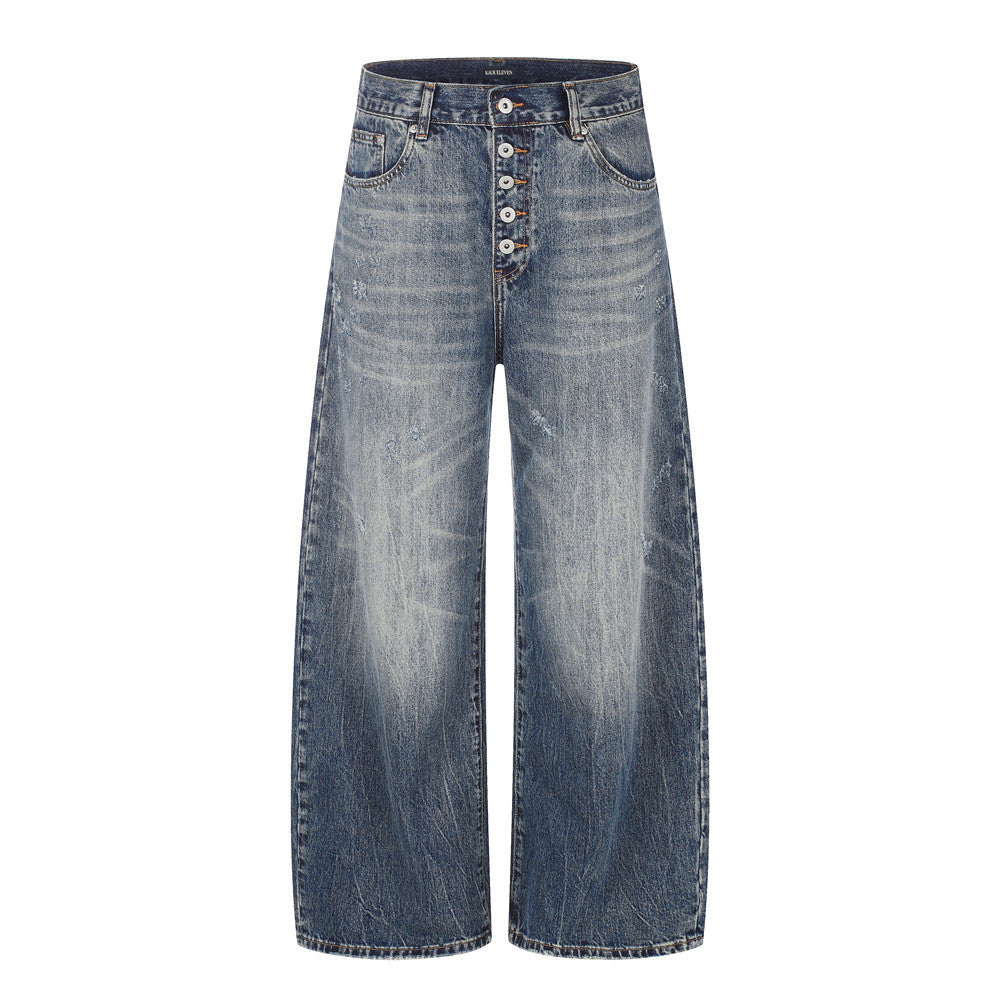 Wide-leg vintage washed distressed denim jeans with exposed button fly in deep indigo, front and back view