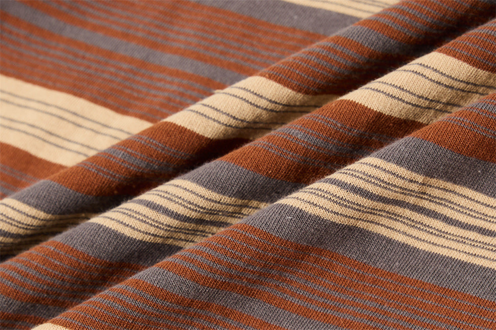 Close-up of soft knit striped fabric in brown, gray, cream and rust