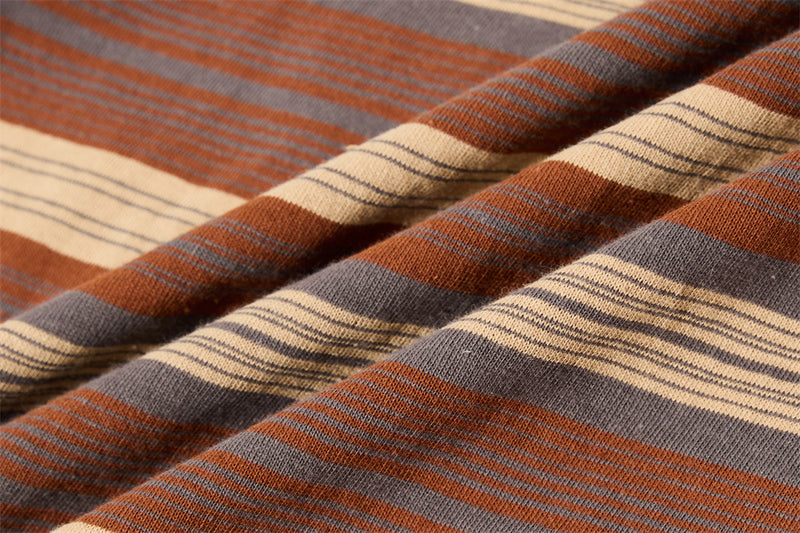 Close-up of soft knit striped fabric in brown, gray, cream and rust