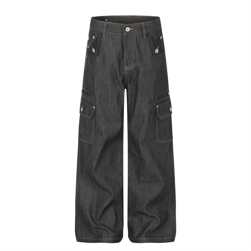 Men's raw black denim wide-leg cargo jeans with snap-button cargo pockets and contrast amber topstitching, front view