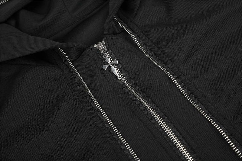 Close-up of the jacket's front zippers with a cross-shaped zipper pull