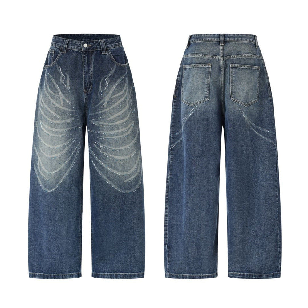 Men's super baggy washed blue jeans with rhinestone wing graphic on wide-leg denim, front and back view