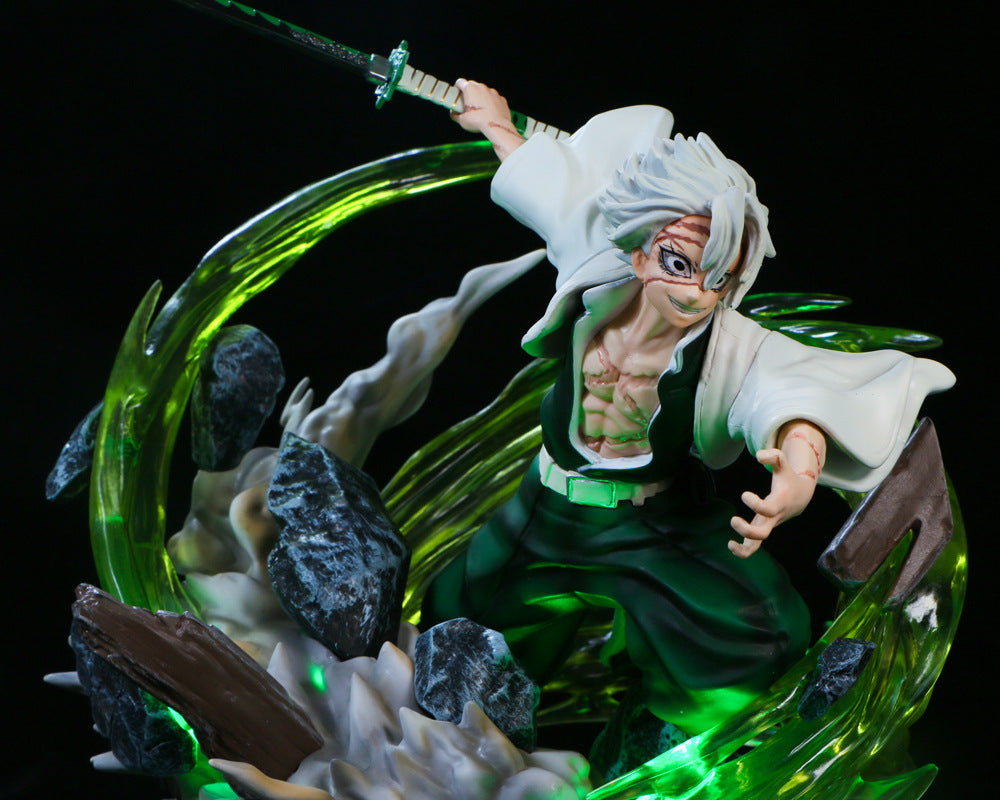 The Premium Demon Slayer Kaze Hashira Sanemi Shinazugawa 30cm GK figure features the white-haired Wind Hashira dynamically posed with a sword, sporting glasses and a white robe over green pants amid swirling green energy and rocks, enhanced by USB light-up effects against a dark backdrop.