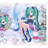 A charming anime character with long teal twin-tails and a colorful dress sits among flowers, having a larger image in the backdrop. The text says "Hatsune Miku" and "Art by DS&