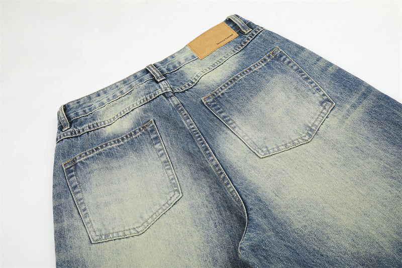 Jean homme coupe large – Denim délavé effet usé avec clous pyramidaux