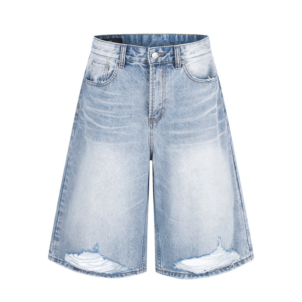 Men's light wash wide-leg distressed denim shorts with raw-edge hem and baggy fit, front view