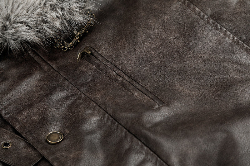 Detail of a brown faux leather jacket chest pocket, snap button, zipper, and fur collar edge