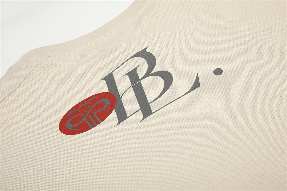 Beige tee upper back detail with script logo and neckline print