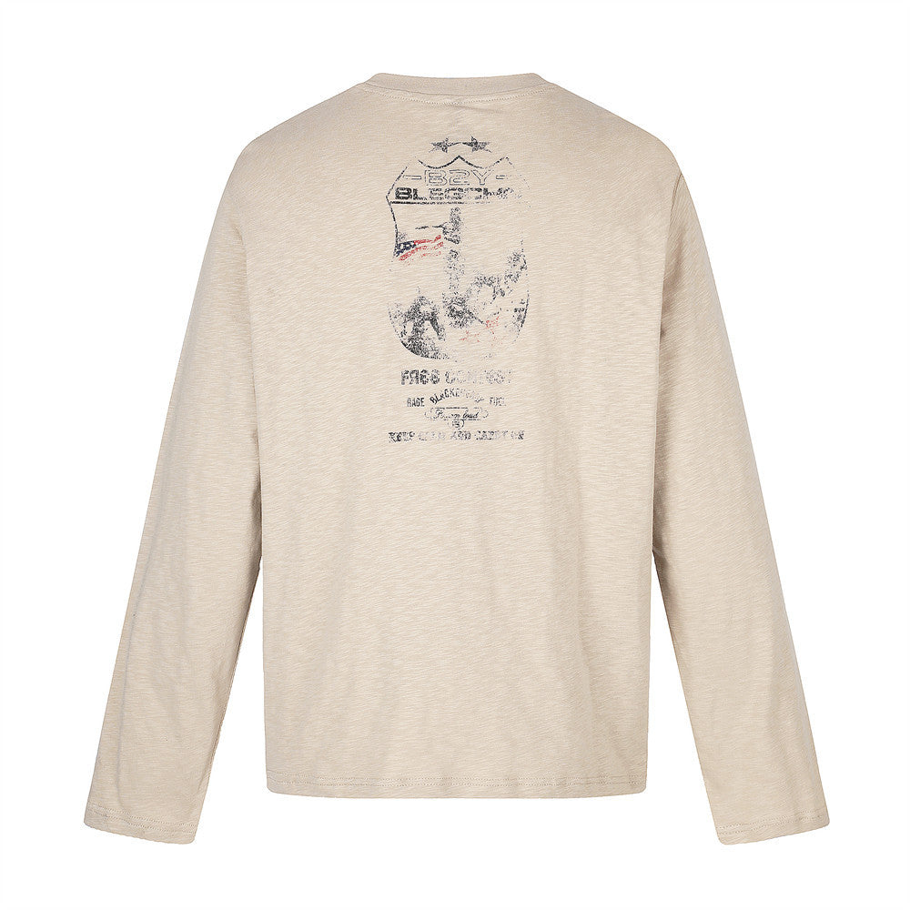 Back view of beige long sleeve tee with faded graphic print near the neck