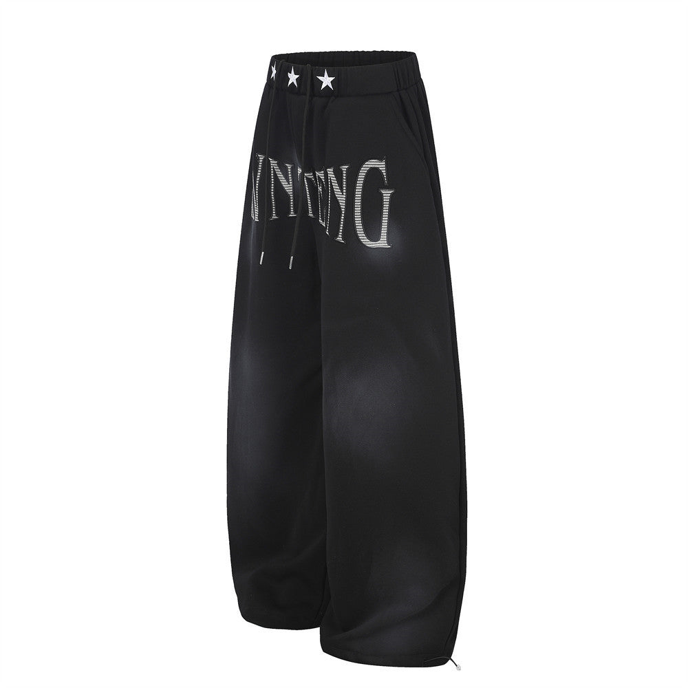 Pantalones de chándal holgados de pernera ancha con lavado efecto spray y gráfico de letras