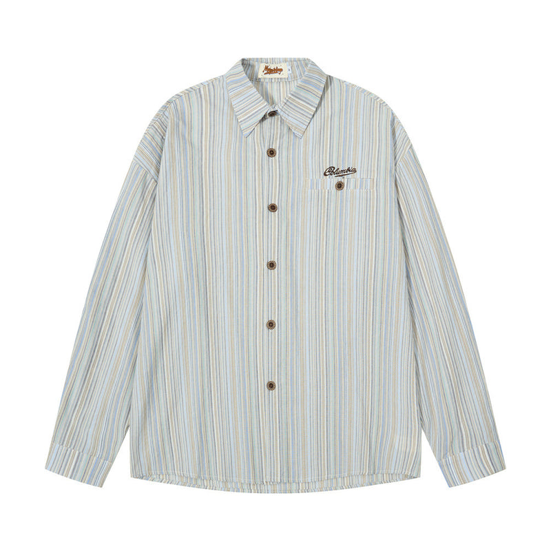 Front view of a light blue striped button-up shirt with chest embroidery and long sleeves