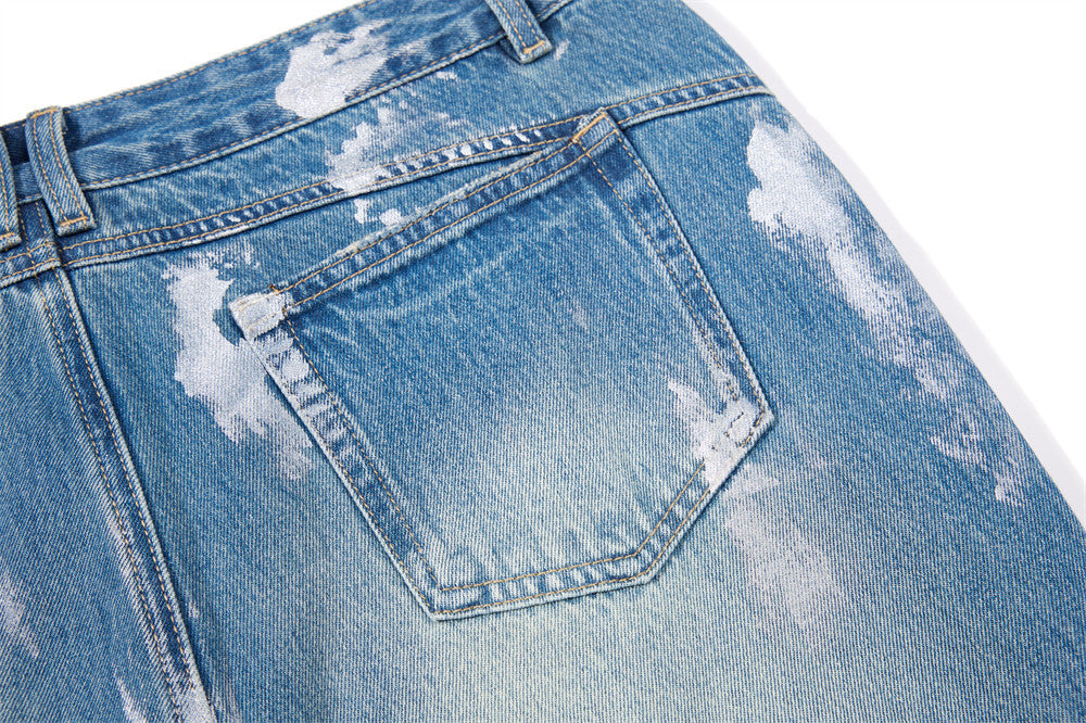 Distressed Flare Jeans – Men's Washed Blue Wide-Leg Denim with Paint Splatter