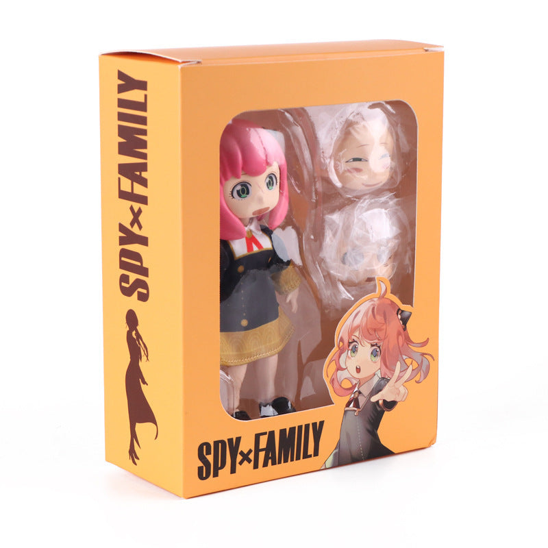 The Seakoff Anya &amp; Yor Forger Nendoroid Set features poseable 13CM Spy x Family action figures. Anya sports her pink hair and dark outfit. The vibrant orange box, adorned with black lettering, includes an extra face piece and character illustrations—a must-have for collectors.