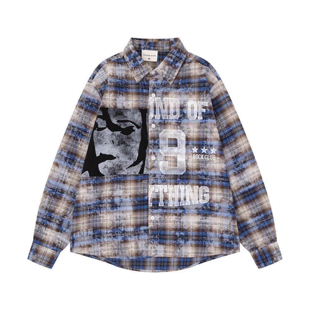 Front view of blue plaid long sleeve shirt with abstract face graphic and bold lettering