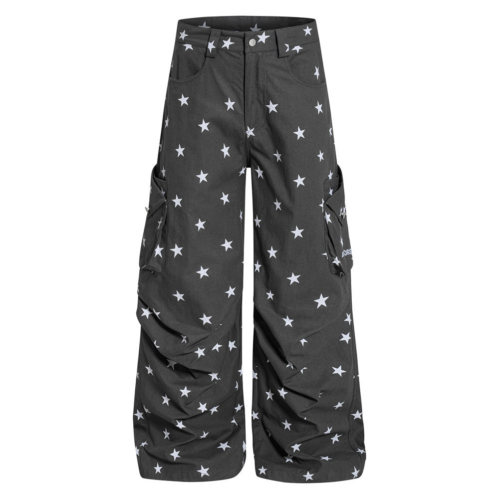 Charcoal wide-leg cargo pants with all-over white star print, oversized fit with ruched hem and cargo pockets, front and back