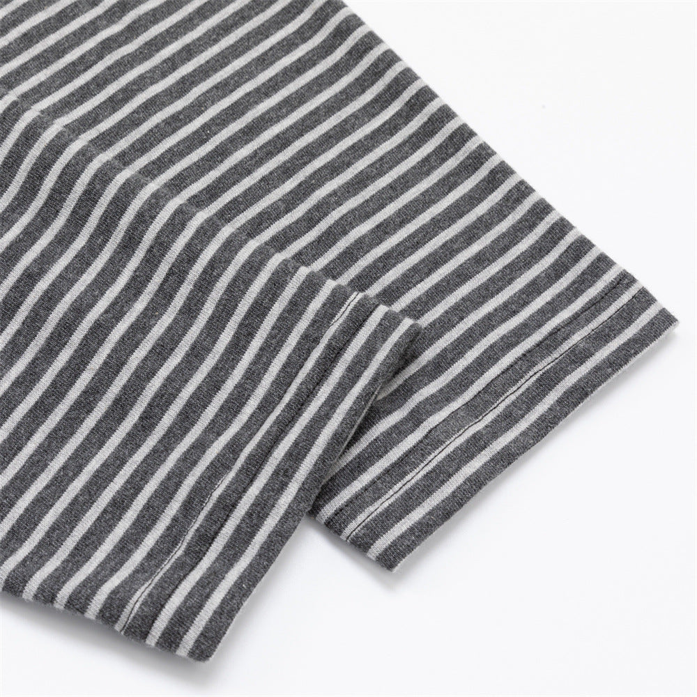 Close-up of the gray and white horizontally striped sleeve fabric and folded cuff edge