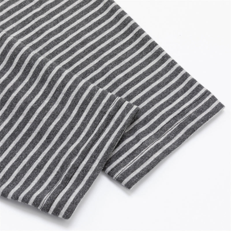 Close-up of the gray and white horizontally striped sleeve fabric and folded cuff edge