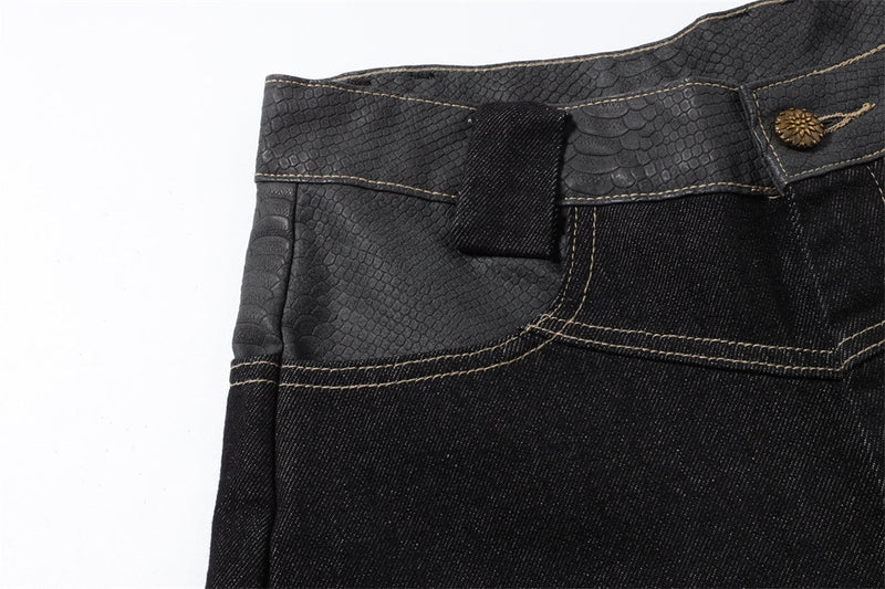 Close-up of the left front waistband and pocket on black denim jeans
