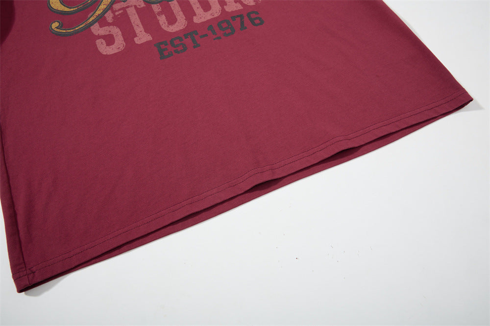 Close-up of hem on burgundy graphic long sleeve shirt
