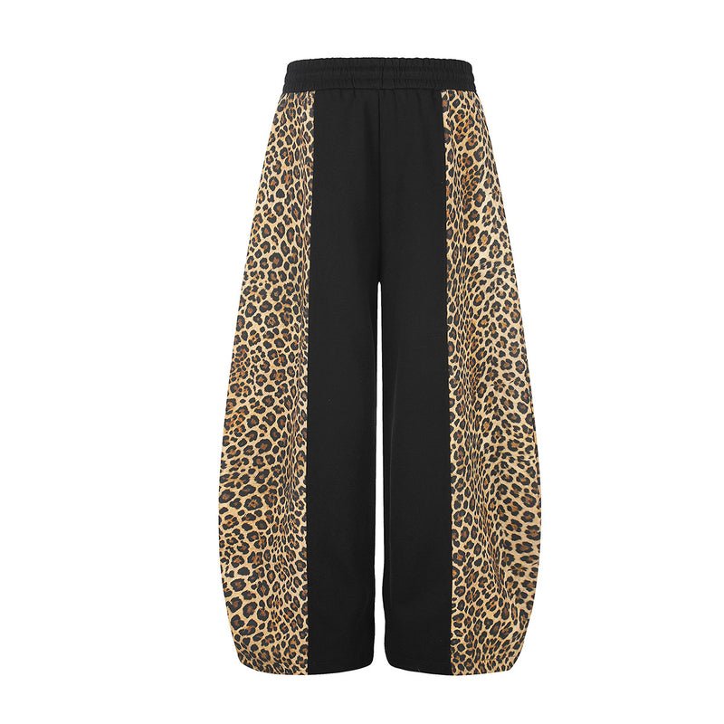 Pantalon de survêtement à jambes larges avec empiècements color-block léopard et bas zippés