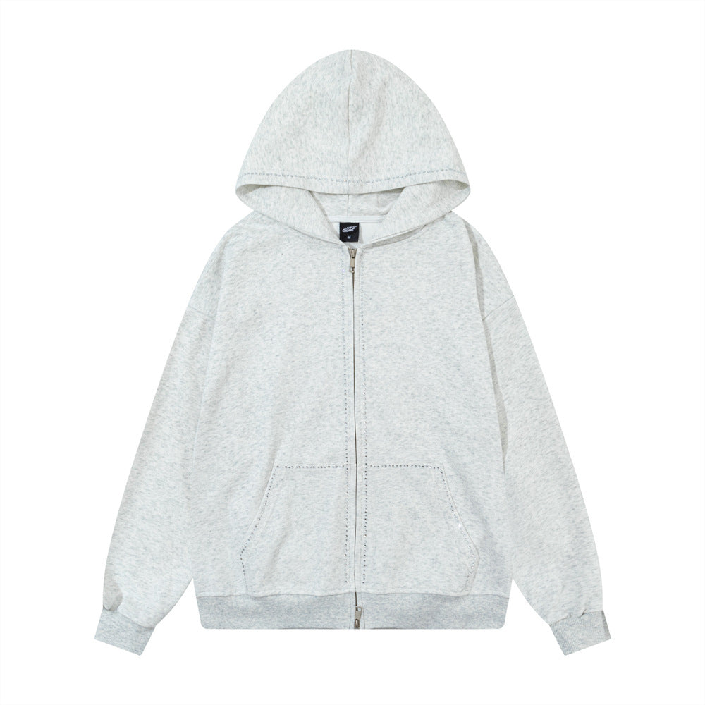 Sweat à capuche oversize zippé délavé gris chiné, avec bordure en strass et double fermeture zippée, vue de face