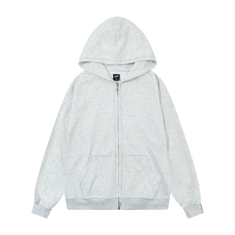 Sweat à capuche oversize zippé délavé gris chiné, avec bordure en strass et double fermeture zippée, vue de face