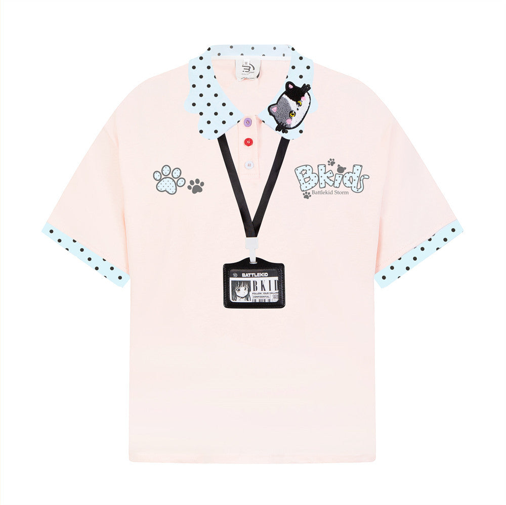 BKids Battlekid Storm oversized polo shirt in pink with polka-dot collar, cat embroidery patch, paw print graphics, and decor