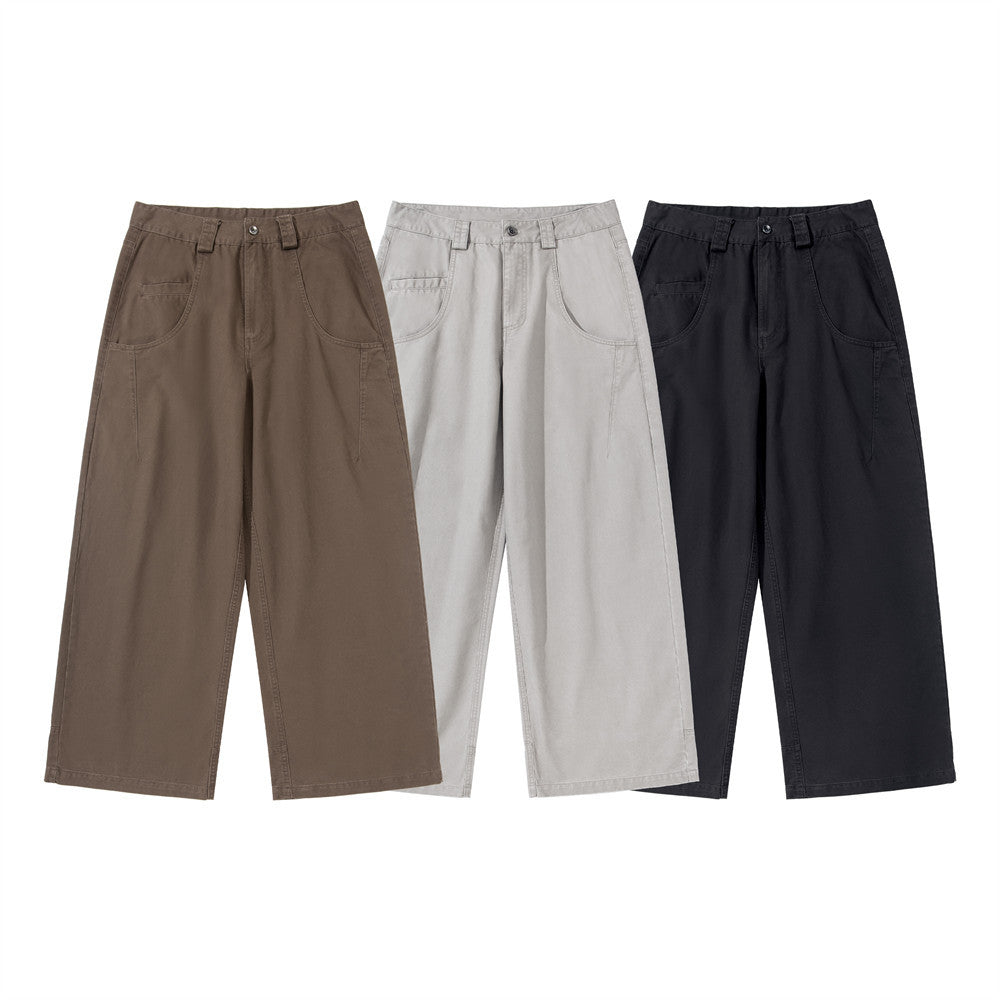 Men's wide-leg workwear trousers with front patch pockets in black, shown front and back view