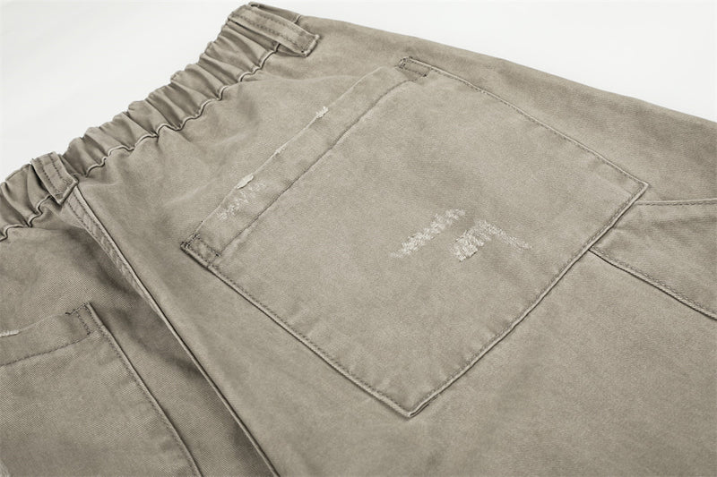 Pantalon cargo wide leg – Kaki délavé, éclaboussures de peinture et chaîne métallique