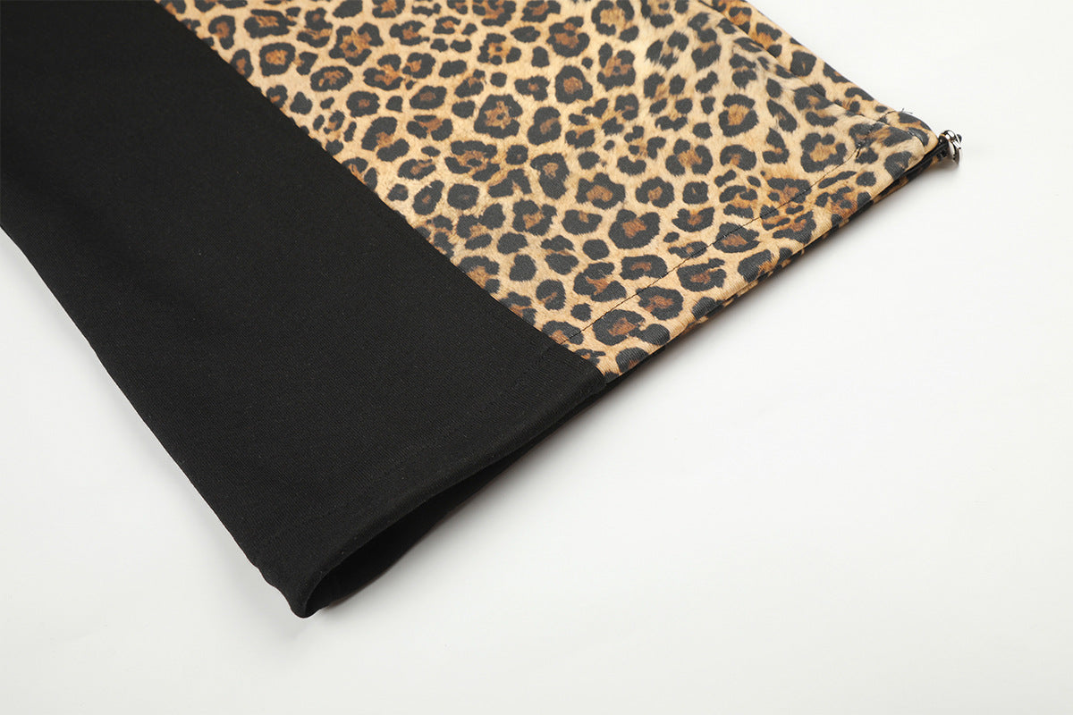 Pantalon de survêtement à jambes larges avec empiècements color-block léopard et bas zippés