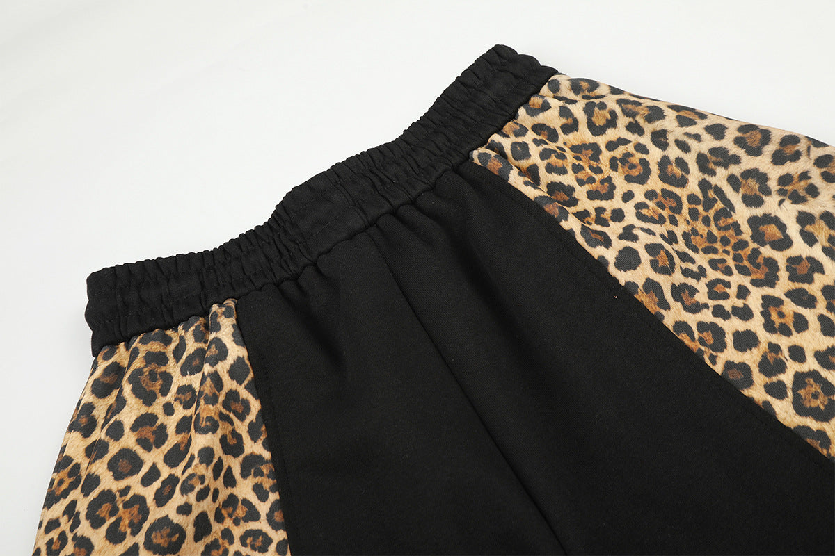 Pantalon de survêtement à jambes larges avec empiècements color-block léopard et bas zippés