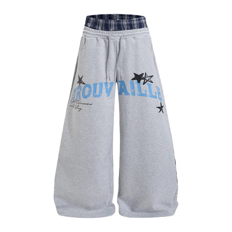 Trouvaille wide-leg sweatpants in heather gray with navy plaid waistband and blue collegiate star graphic print