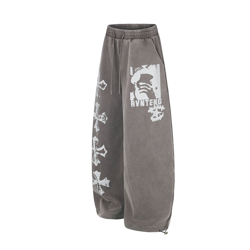 Pantalones de chándal de pierna ancha con cruz estampada y acabado lavado ácido