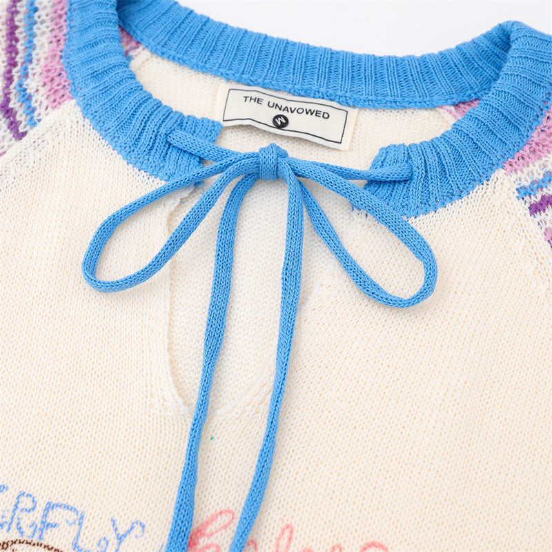 Pull en maille rayé colorblock à manches raglan avec col à lien