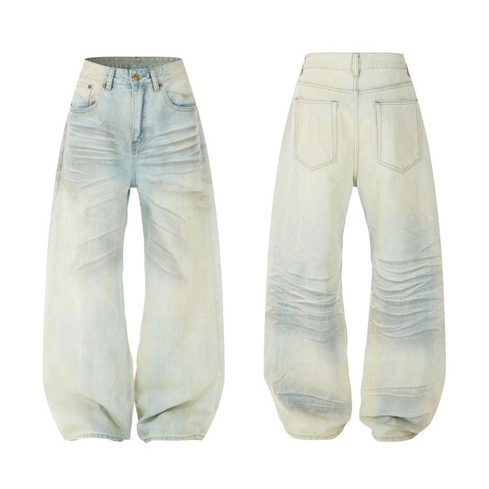 Men's wide-leg light blue washed denim jeans with spray-dye fade and crease distressing, front and back view
