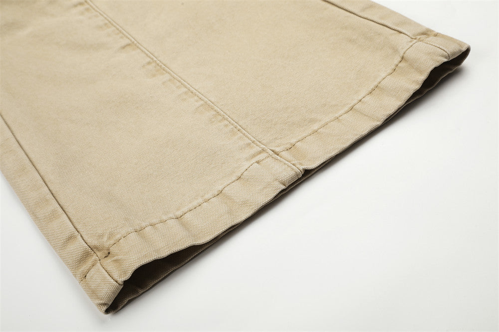 Close-up of beige cargo pants hem with straight stitched cuff