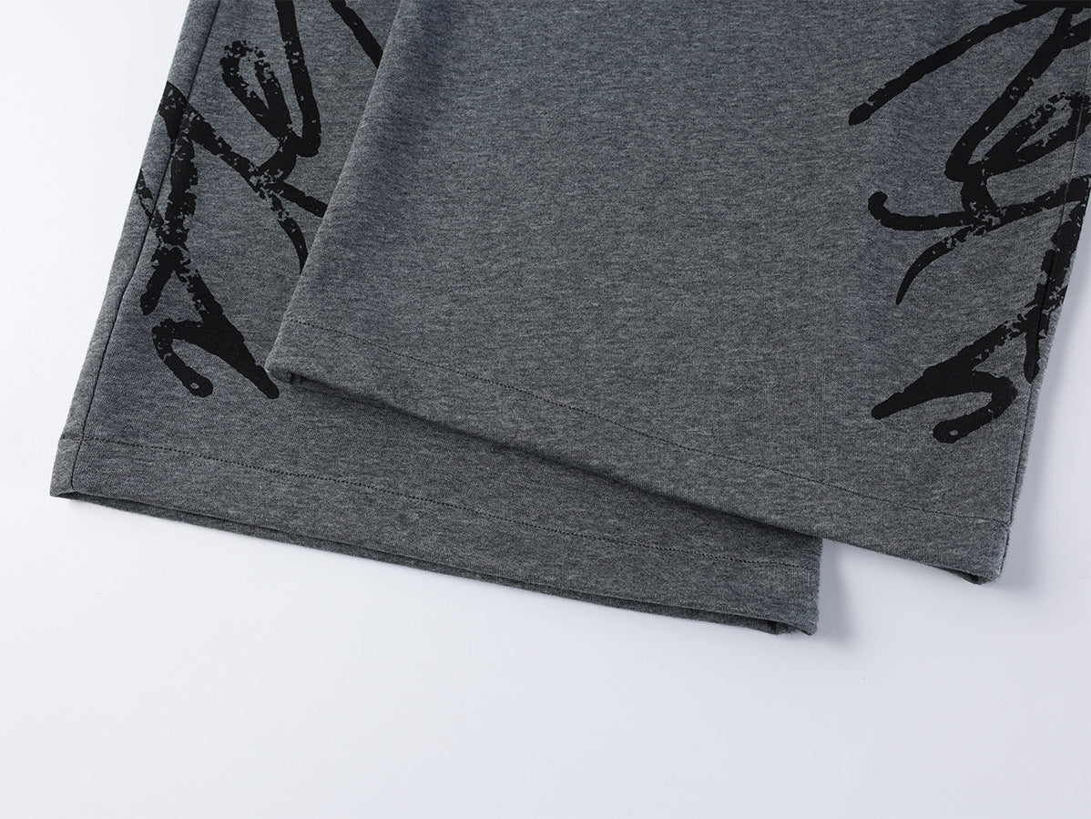 Pantalon de survêtement à jambes larges avec imprimé graffiti cursif et ceinture élastiquée siglée