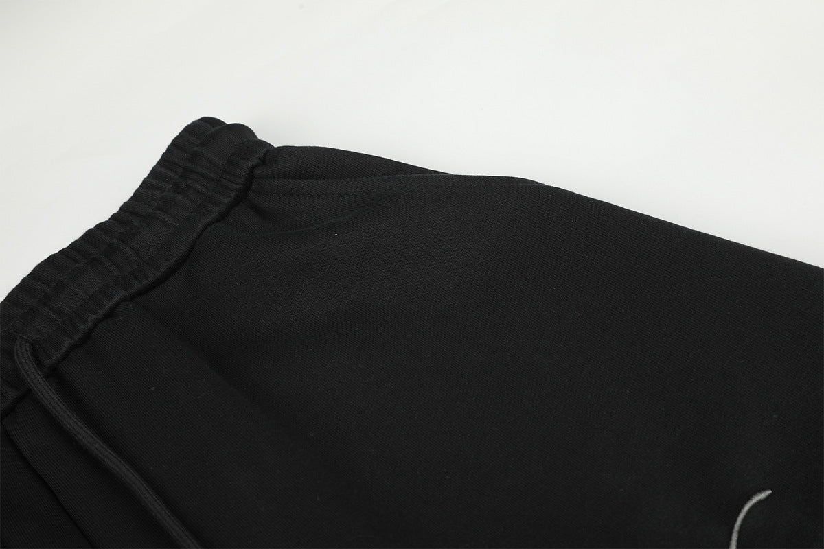 Pantalon de survêtement à jambes larges avec délavage dégradé et plis aux genoux