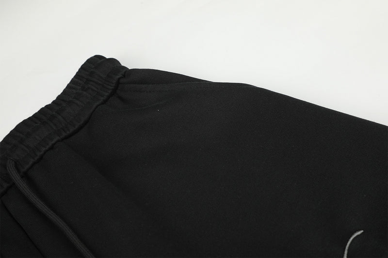 Pantalon de survêtement à jambes larges avec délavage dégradé et plis aux genoux