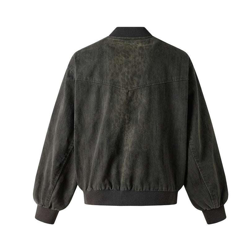 Veste bomber en jean délavé déconstruite à empiècement croisé et coutures effilochées