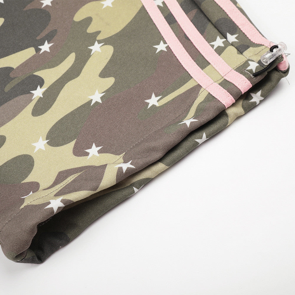 Close-up of hem on camo pants with pink side stripes and gathered cuff